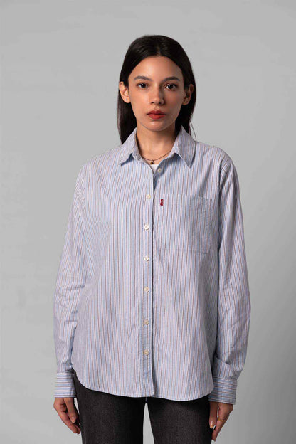 Striped button-down shirt in light blue with vertical pinstripes and chest pocket
