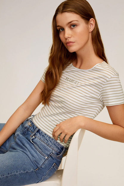 Beige striped short-sleeve top with front logo, paired with blue jeans