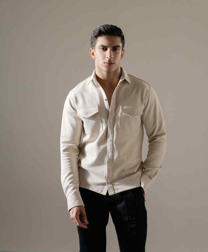 Men's beige fitted button-up shirt with chest pockets and long sleeves, button front