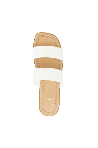 Dune London white slide sandals with two wide cross straps and tan sole