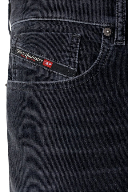 Diesel denim jeans close-up of front pocket with Diesel logo patch