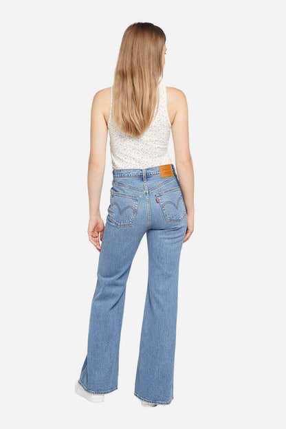 Levi's medium indigo wide-leg jeans, back view with yoke stitching and back pockets