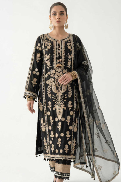 Black kurta with ornate gold embroidery and flared sleeves; sheer dupatta draped