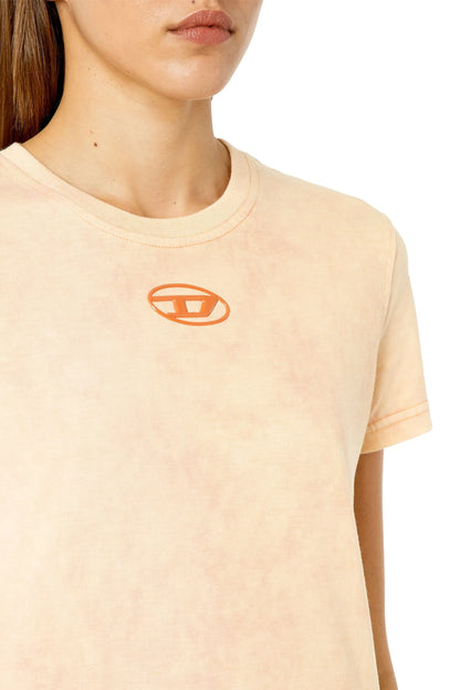 Pink Diesel crew-neck T-shirt close-up showing orange oval logo print.
