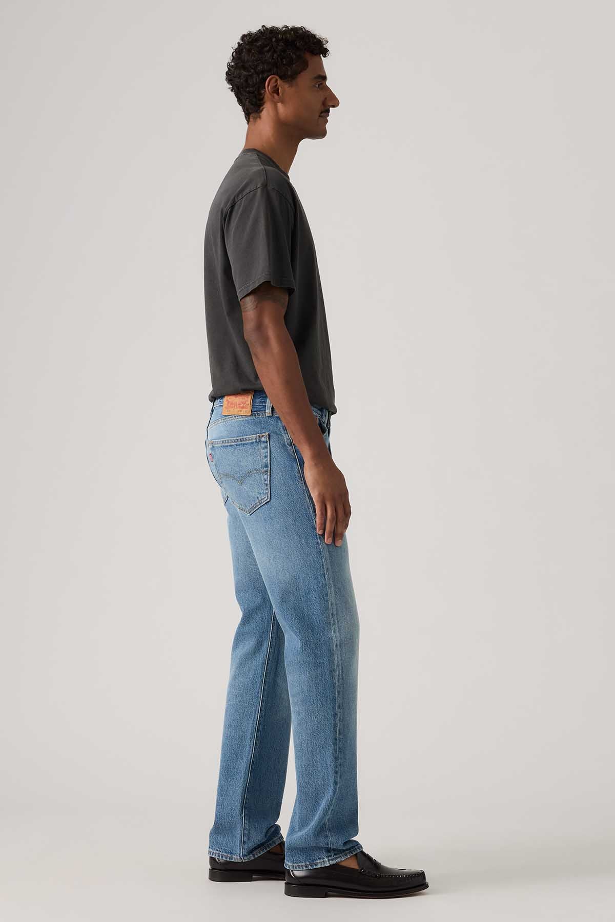 Levi's light blue denim jeans side view, straight legs, five-pocket design