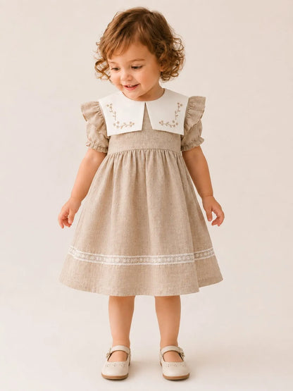 Girls stone linen dress with puff sleeves, white embroidered collar, and lace trim