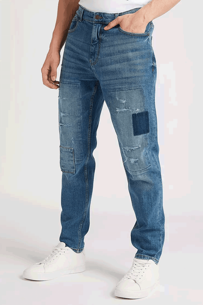 Men's blue denim jeans, relaxed straight fit with ripped knees and cargo-style pocket