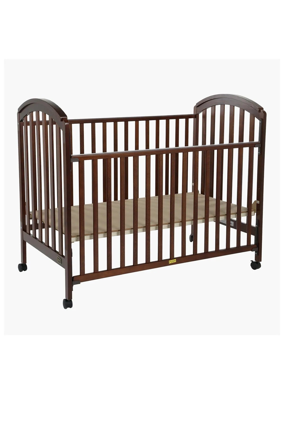 Black and brown wooden baby crib with side slats, low rails, and caster feet