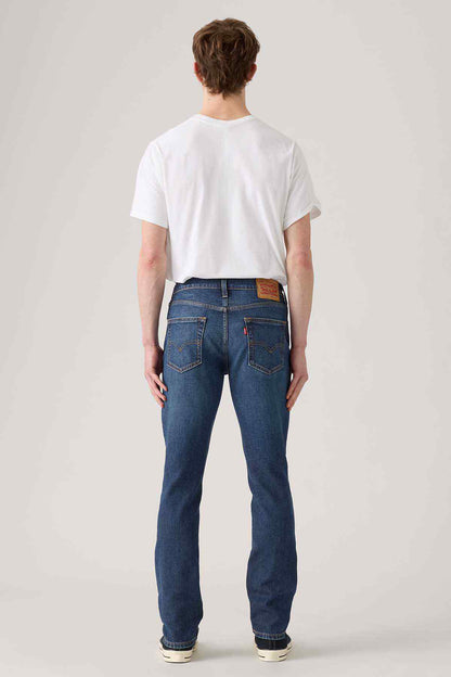 Levi's dark indigo denim jeans back view, yoke stitching and belt loops