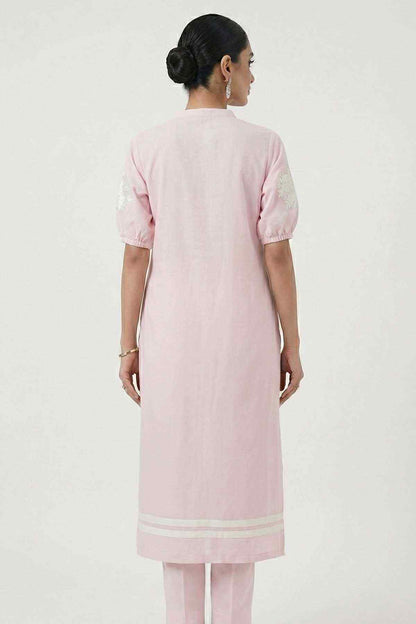 Light pink kurta back view with short sleeves and white embroidered border at hem