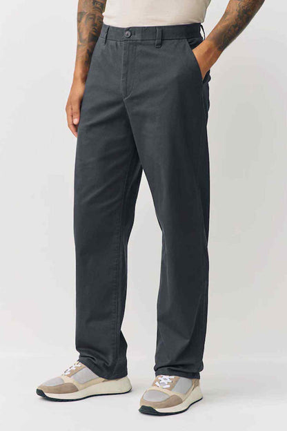 Dark grey trousers with side pockets and relaxed straight fit
