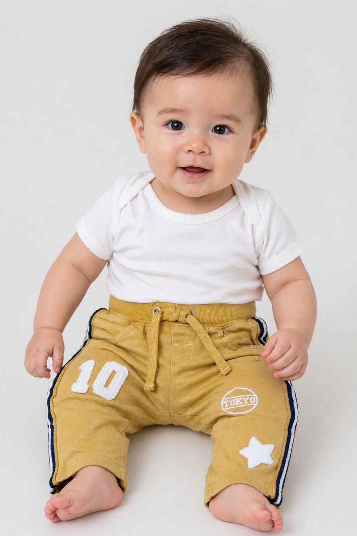 BABYSHOP yellow baby pants with drawstring waist, side stripes, and patch details