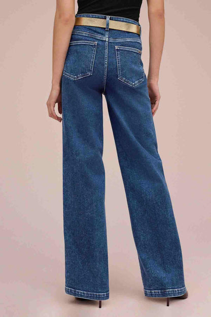 High-rise dark blue denim jeans with belt loops and wide flared legs