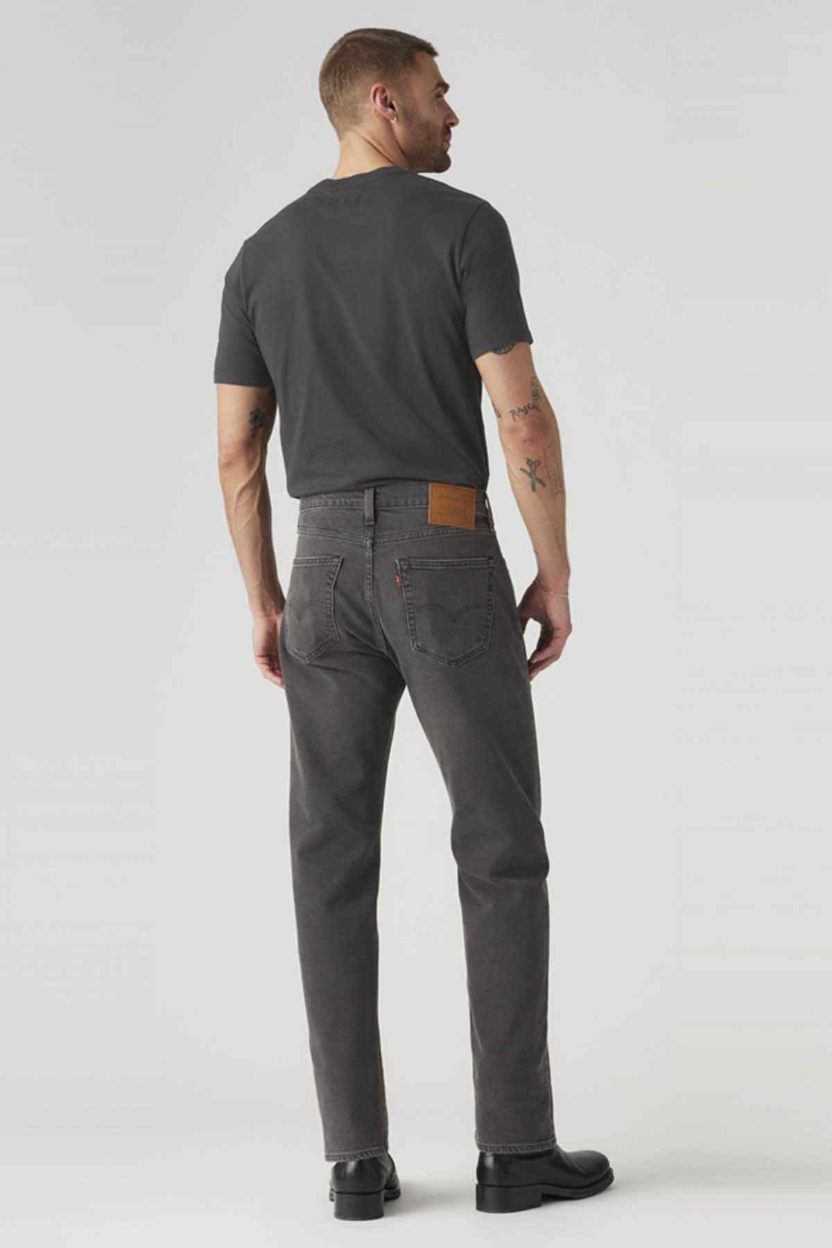 Back view of dark denim jeans with back pockets and belt loops