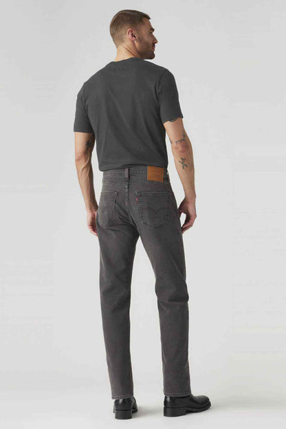 Back view of dark denim jeans with back pockets and belt loops