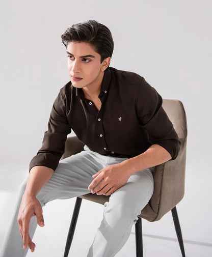 Slim fit button-up shirt in dark black, front button placket, long sleeves