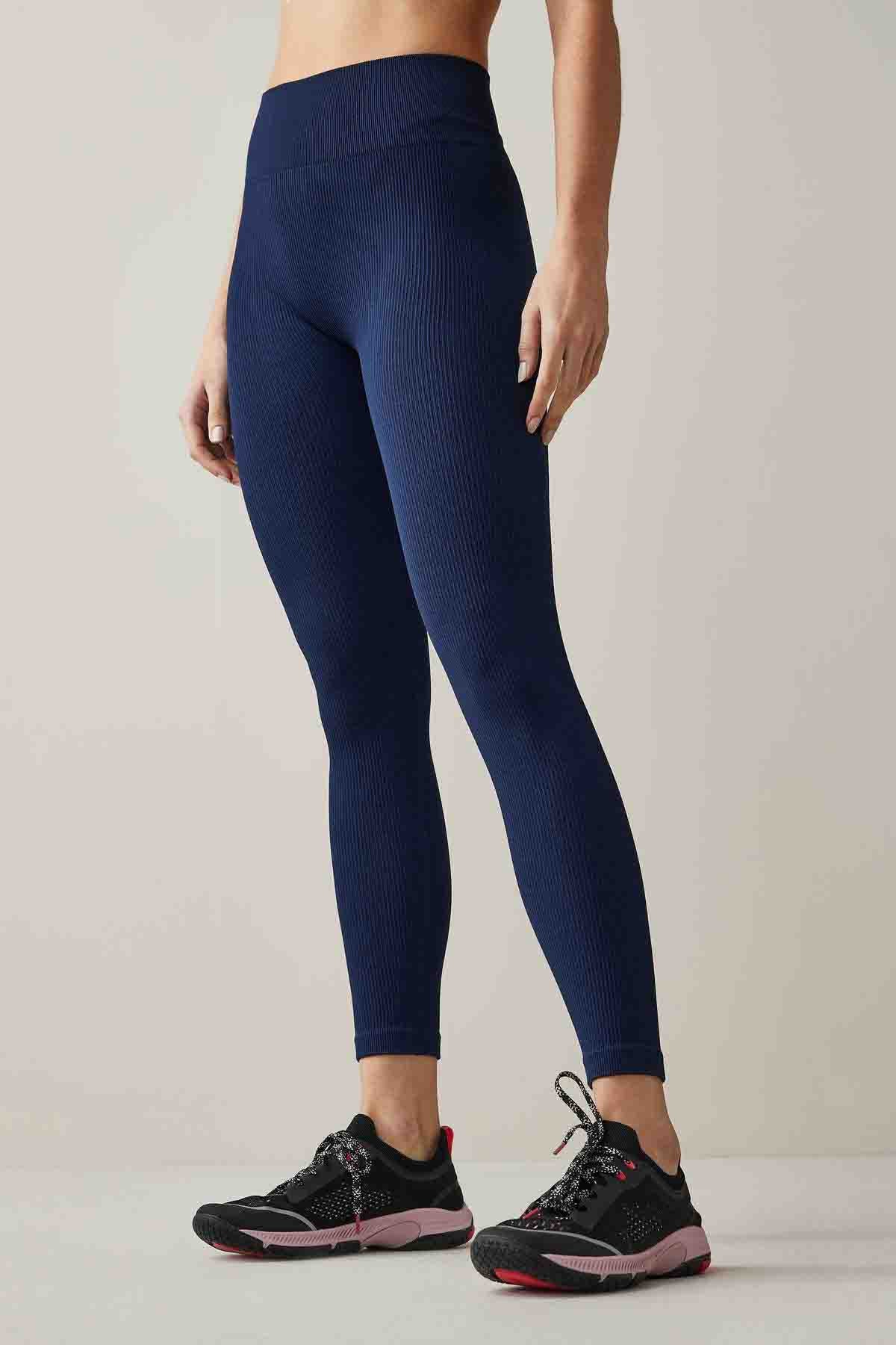Navy seamless-look leggings with fitted skinny legs and ankle-length hem