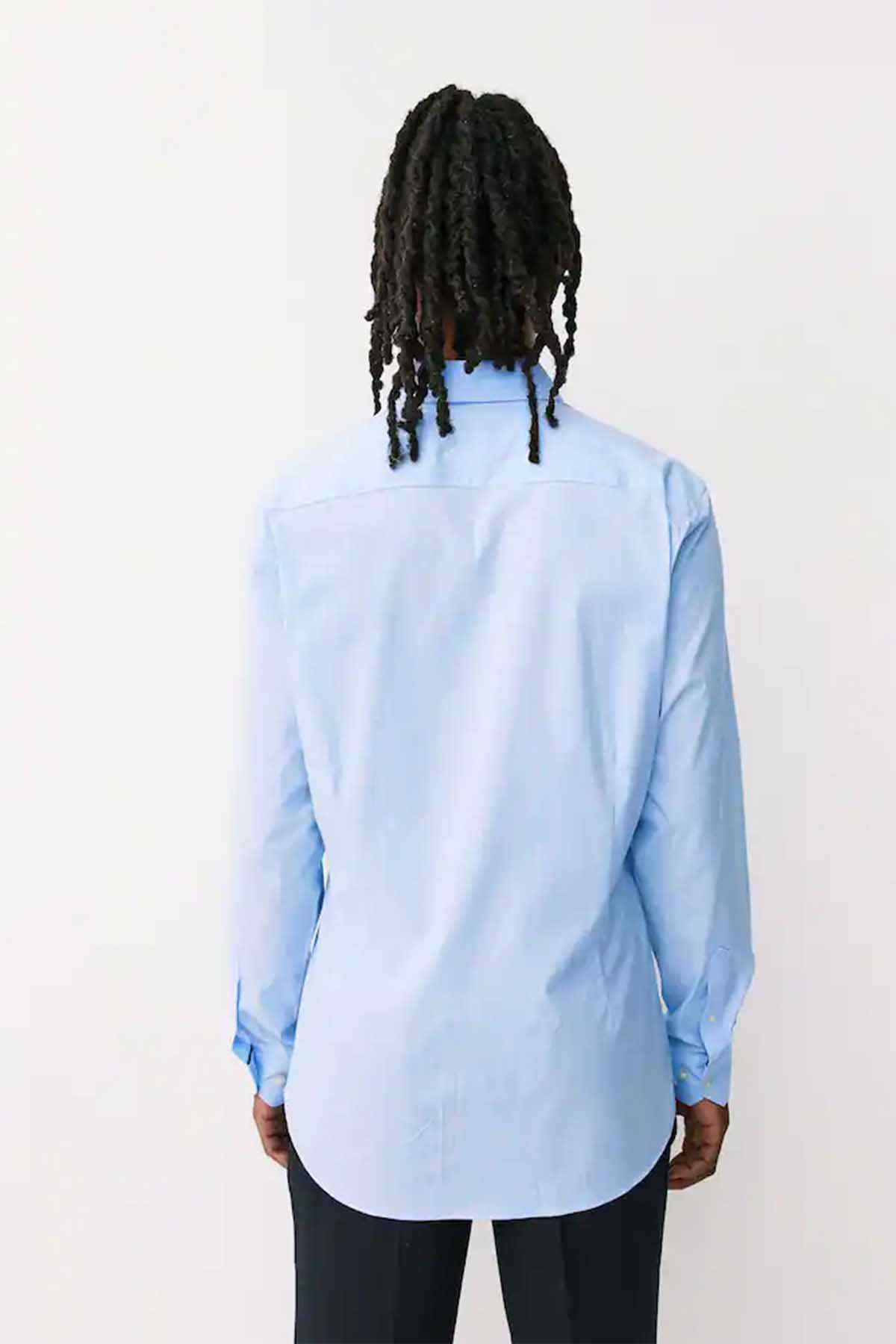 Light blue button-up shirt back view with long sleeves and curved hem