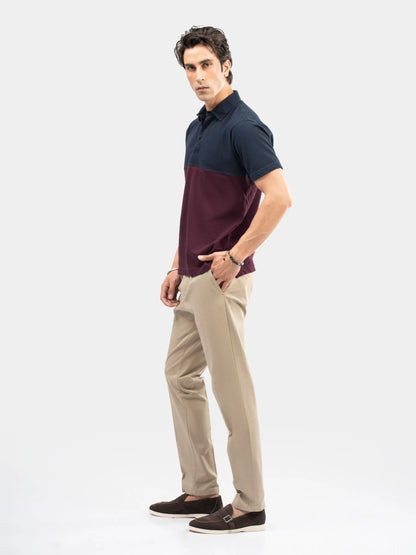 Color-block polo shirt in navy and burgundy, short sleeves, side view, cotton