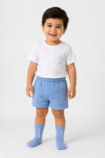 BABYSHOP blue infant socks with ribbed cuffs, worn by child in shorts