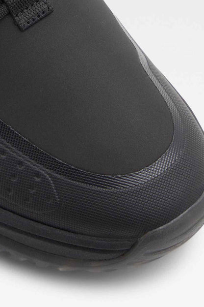 Black rubber toe and textured upper edge on chunky sneaker sole
