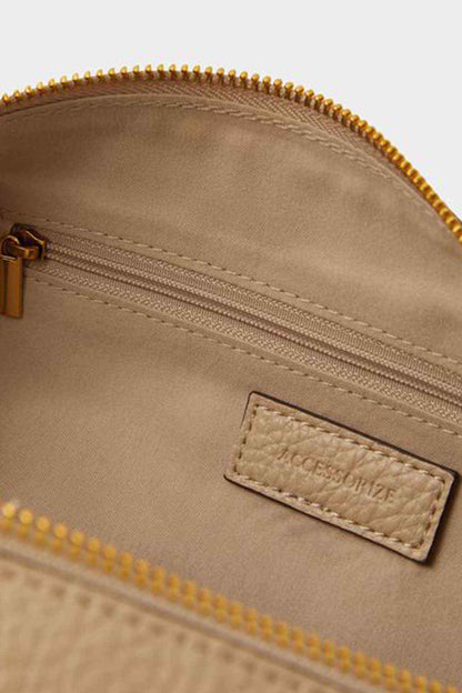 Accessorize mink bag close-up of zip track and front logo patch