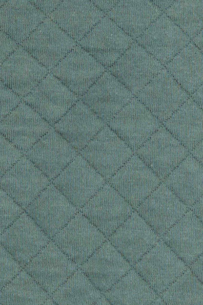 Quilted teal-green vest fabric with diamond texture
