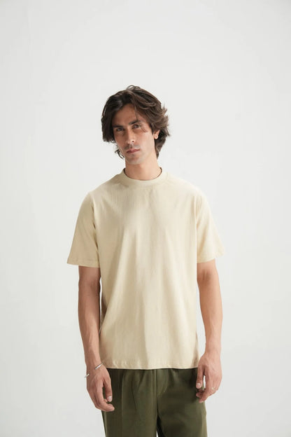 Beige short-sleeve crewneck T-shirt on male model, front view
