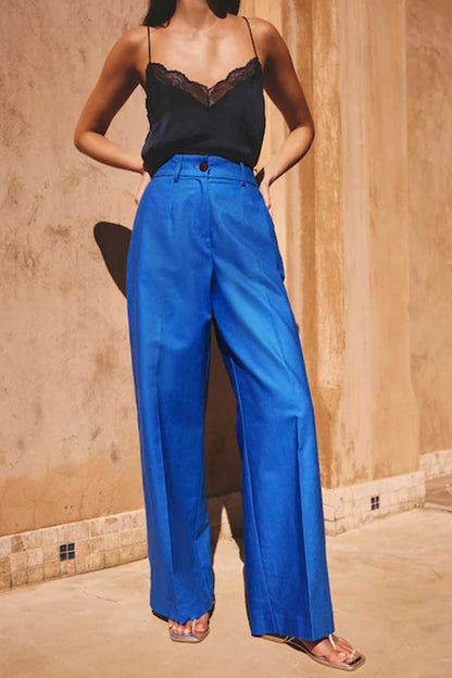 Women’s blue high-waist wide-leg trousers with waistband and fly front detail
