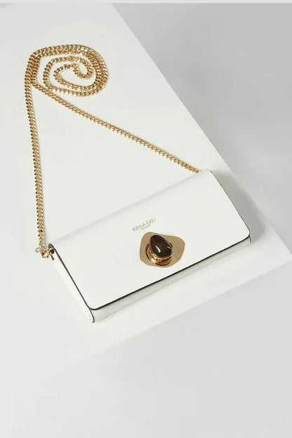 White leather crossbody flap clutch with gold chain and round clasp