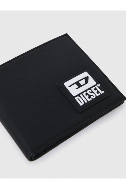 Black leather wallet with Diesel logo label patch, angled close-up