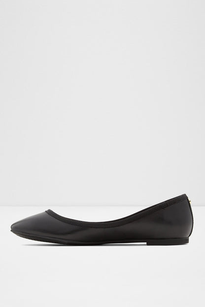Black ballet flat with rounded toe and flat low sole, angled front view