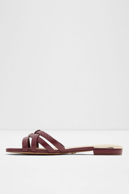 Bordo slide sandals with wide cross straps and flat slide sole