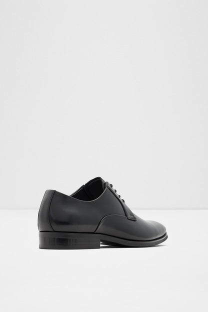 Black leather lace-up oxford shoe, back quarter view with low stacked heel