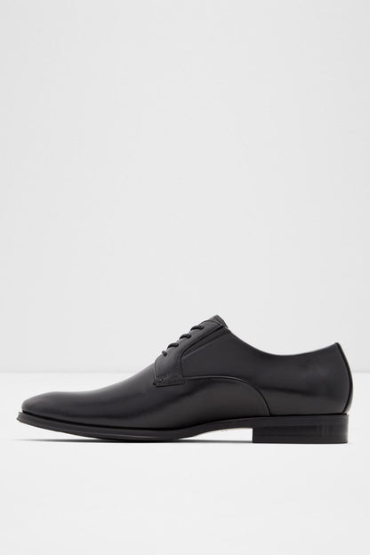 Black leather lace-up oxford shoe with rounded toe, front-side profile