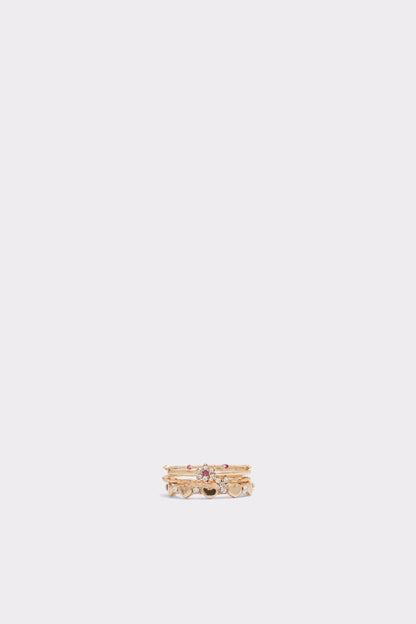 Gold-tone stacked ring with oval blue center stone and tiny clear stones