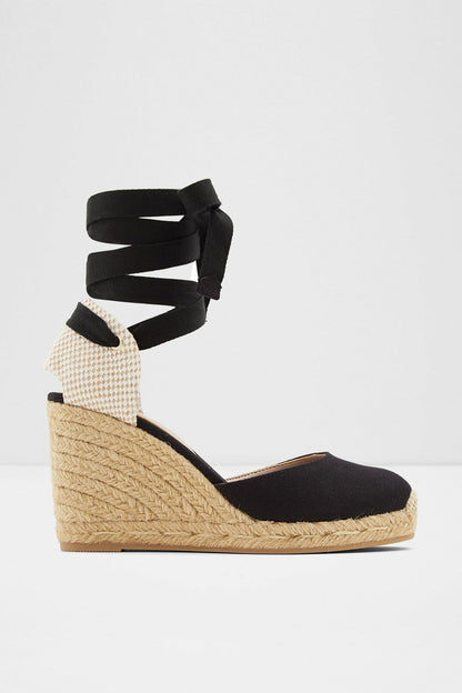 Black espadrille wedge sandal with ankle wrap straps and jute platform