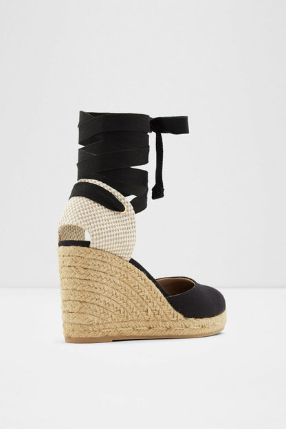Black espadrille wedge sandal with high ankle wrap, jute platform and patterned strap