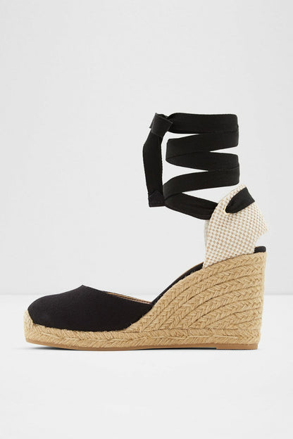 Black espadrille wedge sandal with ankle wrap straps and jute wedge platform