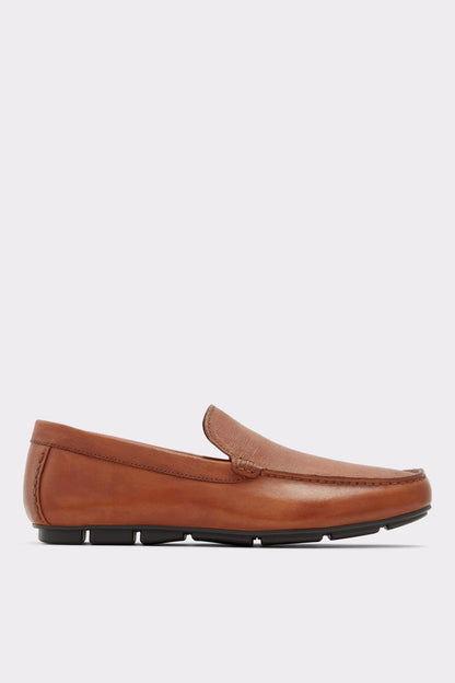 Cognac brown leather loafer with slip-on design and ridged black rubber sole