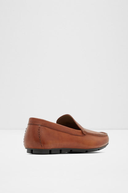 Cognac brown slip-on loafer shoe with stitched upper and low-profile black sole