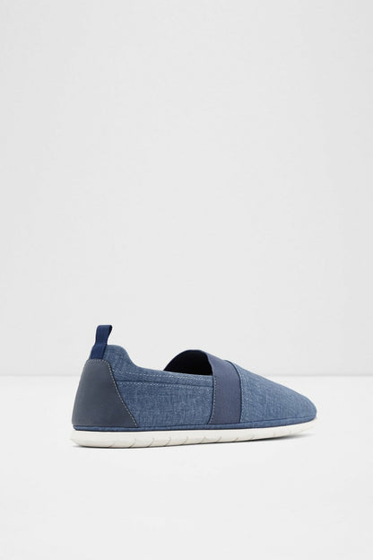 Blue canvas slip-on sneaker, low profile with elastic strap at top