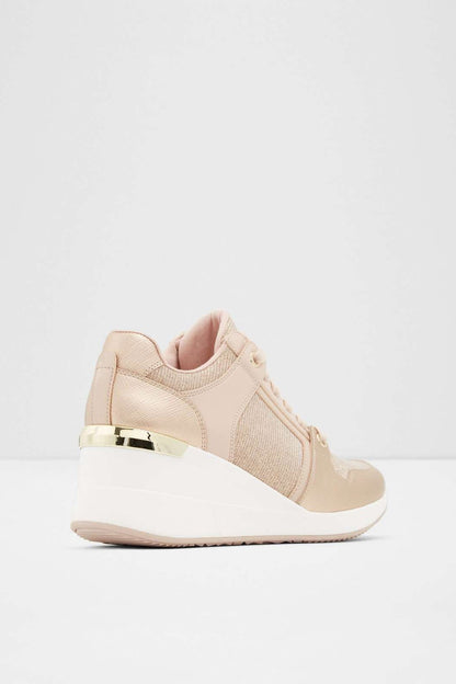ALDO light pink wedge sneaker heel view with padded collar
