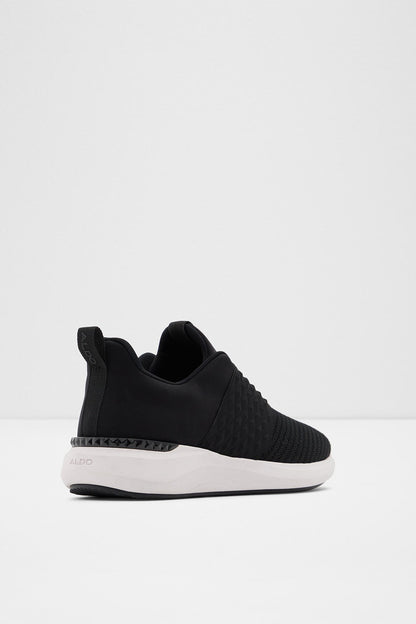 Black knit slip-on sneaker with heel pull tab and white rubber sole