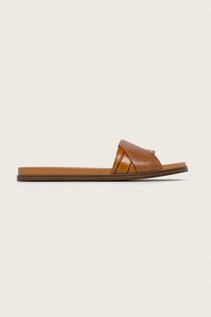 Rust-copper slide sandal with crosshatch strap and flat sole