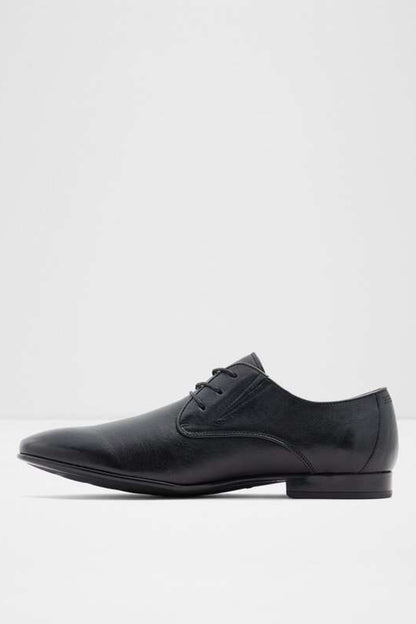 Black lace-up dress shoe side view with stitched leather upper