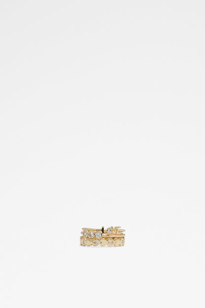 Gold LOVE word ring with clear rhinestone row and heart detail