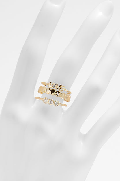 Gold LOVE ring with rhinestone accents and cutout heart shapes