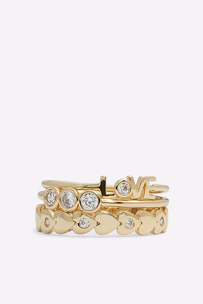 Gold LOVE word ring with heart-like cutouts and clear rhinestones