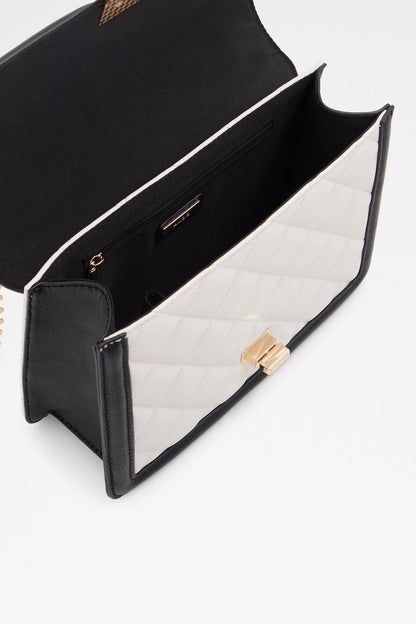 Quilted shoulder bag open view, black interior, white lining, gold clasp and zipper pocket